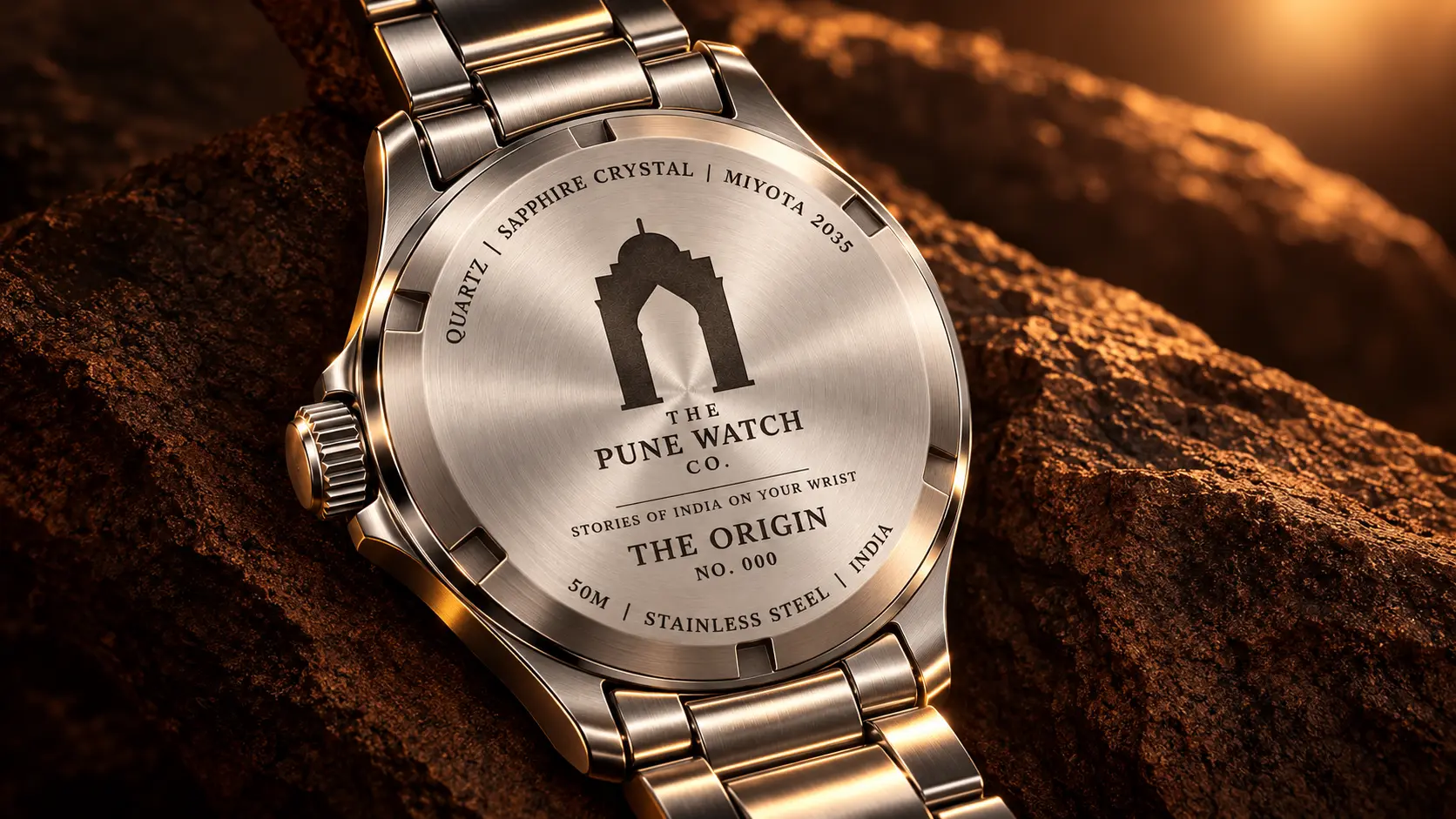 The full watch caseback glowing in amber light